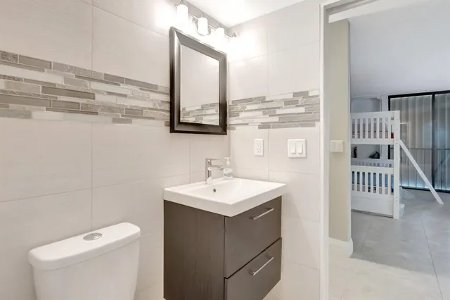 a bedroom with a bed and a table in it