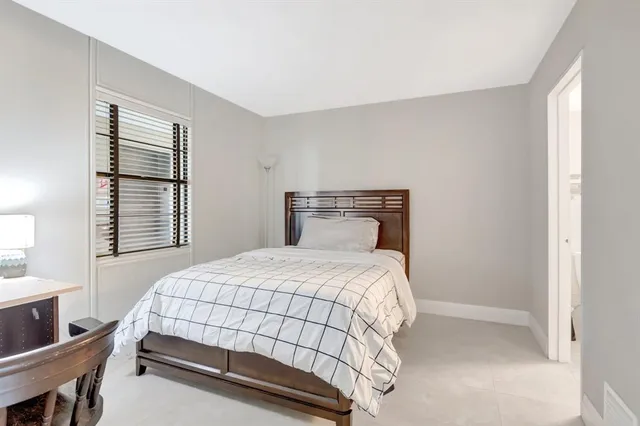 a view of a green field with lots of bushes