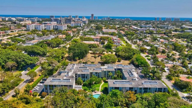 an aerial view of a house with a swimming pool