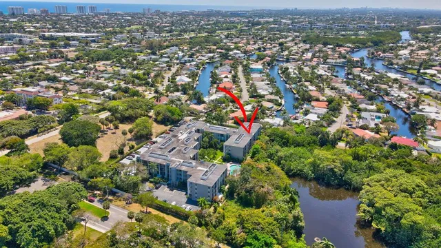 an aerial view of residential building and parking space