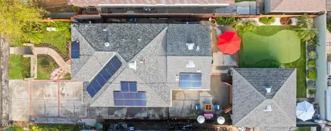 a front view of a house with a backyard