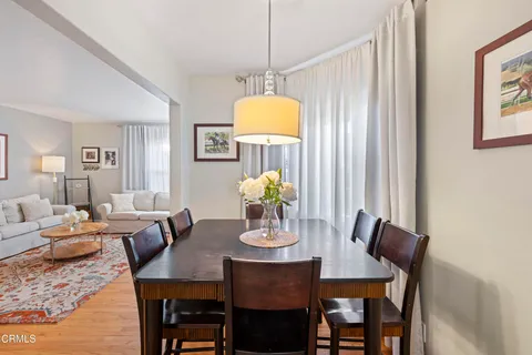 a dining room with furniture and window