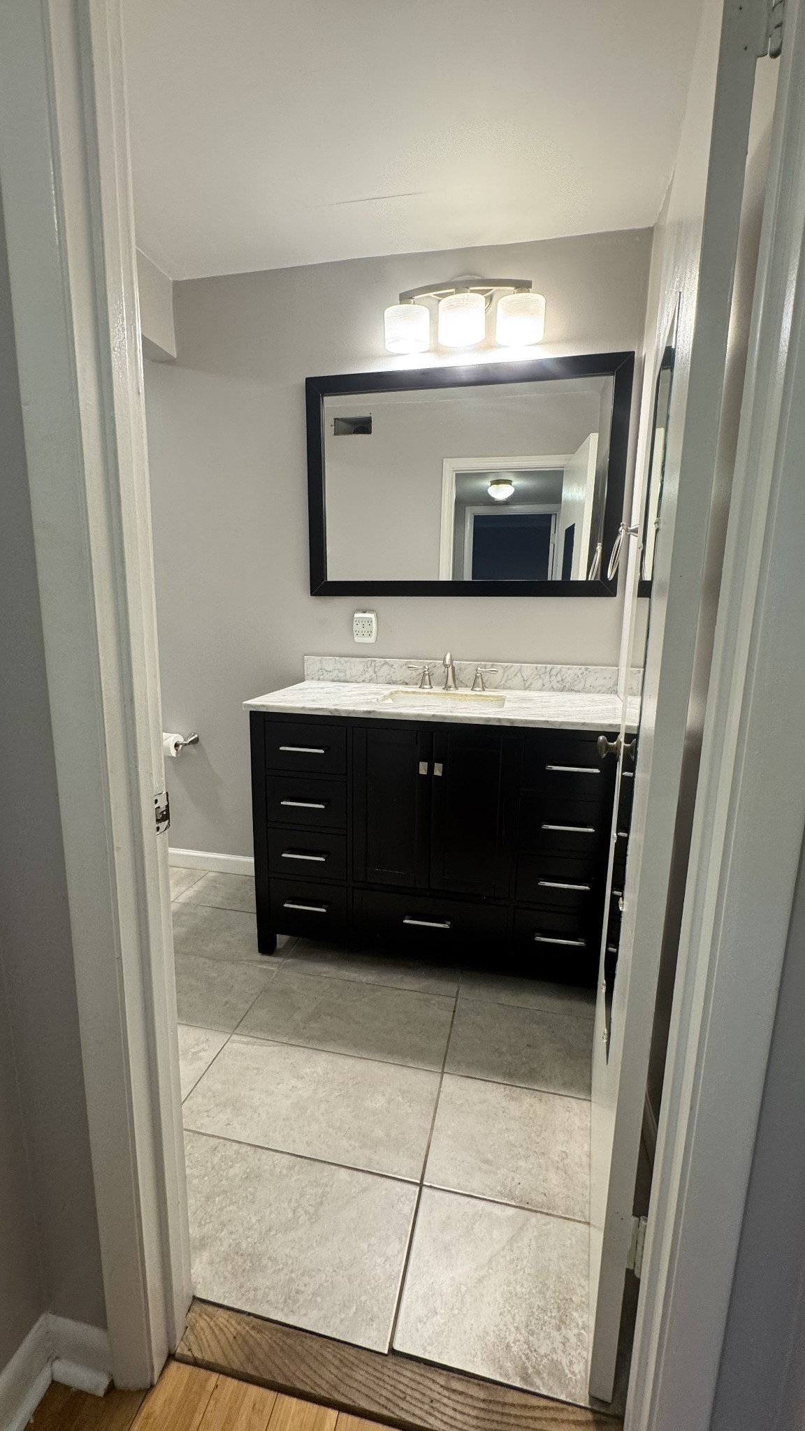 420 Walton Lane, Unit J48 Madison, TN 37115 - Photo 11 of 15 a bathroom with a sink and a mirror