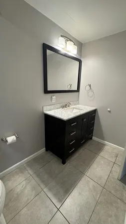 a living room with a furniture and a flat screen tv