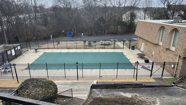 a view of a patio with table and chairs with wooden floor