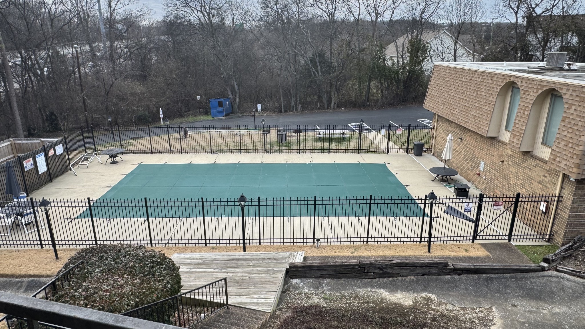 420 Walton Lane, Unit J48 Madison, TN 37115 - Photo 14 of 15 a view of a patio with table and chairs with wooden floor