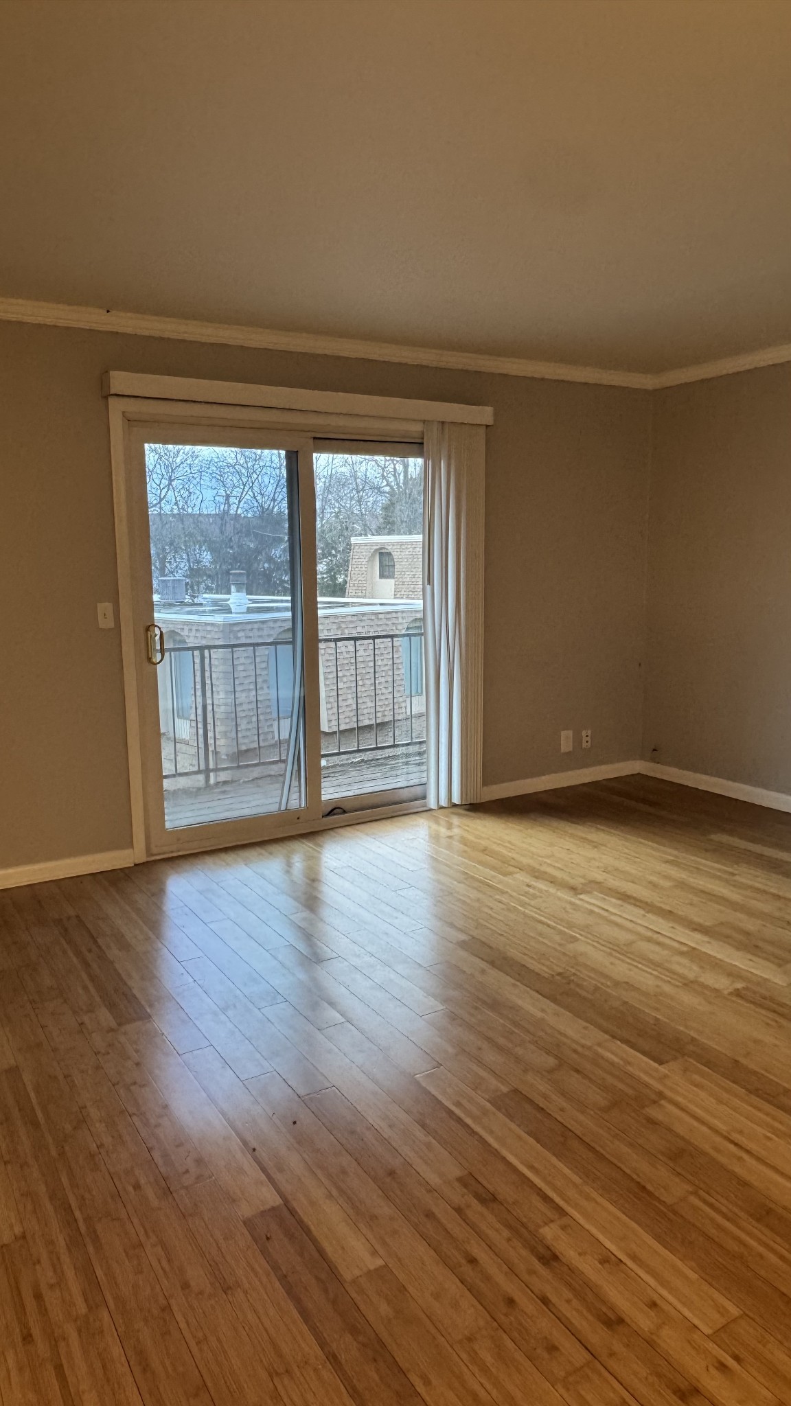420 Walton Lane, Unit J48 Madison, TN 37115 - Photo 2 of 15 a view of an empty room with wooden floor and a window