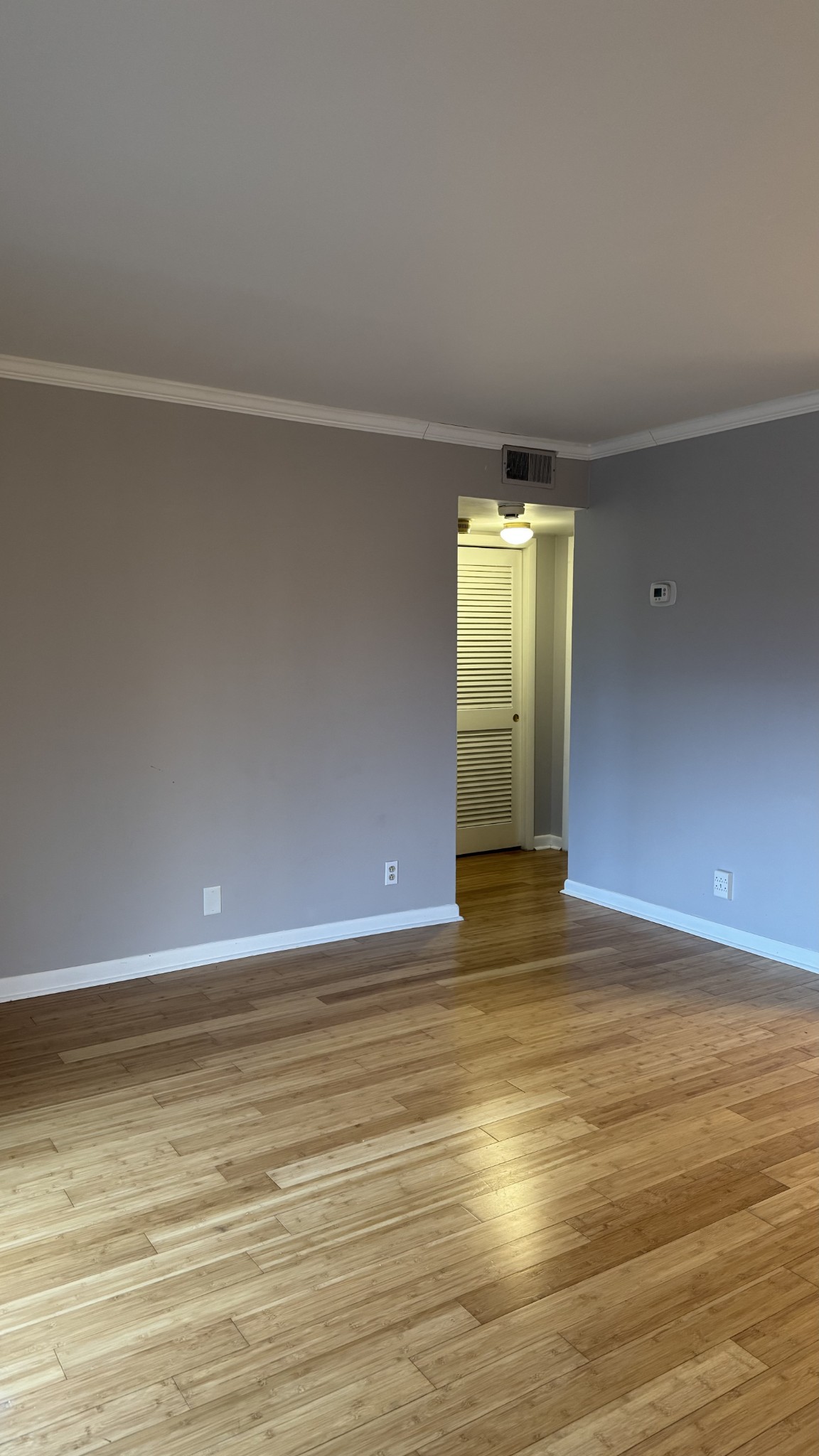 420 Walton Lane, Unit J48 Madison, TN 37115 - Photo 3 of 15 a view of an empty room with wooden floor and a window