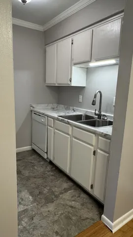 a kitchen with a sink and cabinets