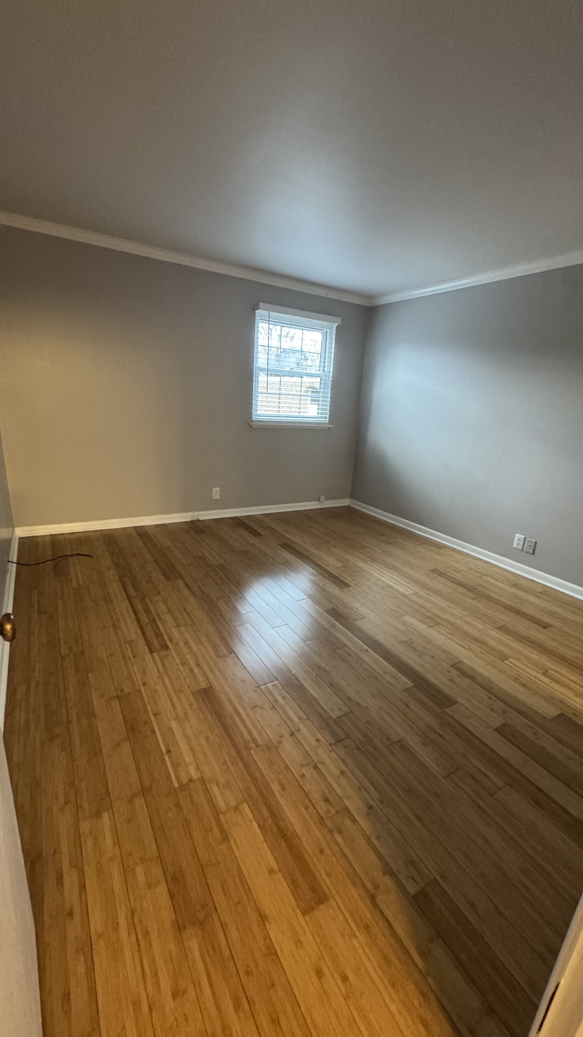 420 Walton Lane, Unit J48 Madison, TN 37115 - Photo 8 of 15 an empty room with wooden floor and windows