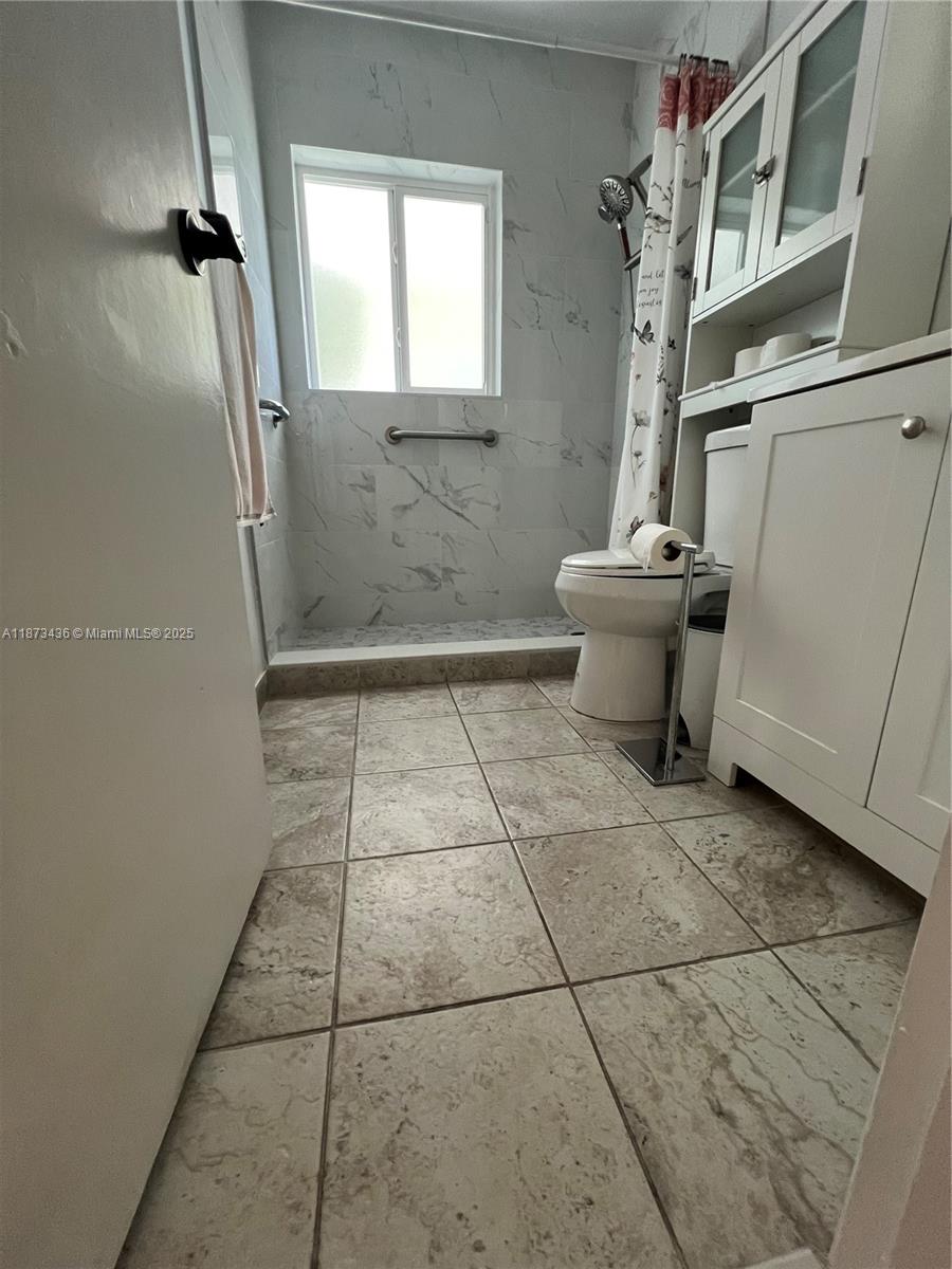 10315 Southwest 152nd Terrace Miami, FL 33157 - Photo 4 of 12 a view of a bathroom with a toilet