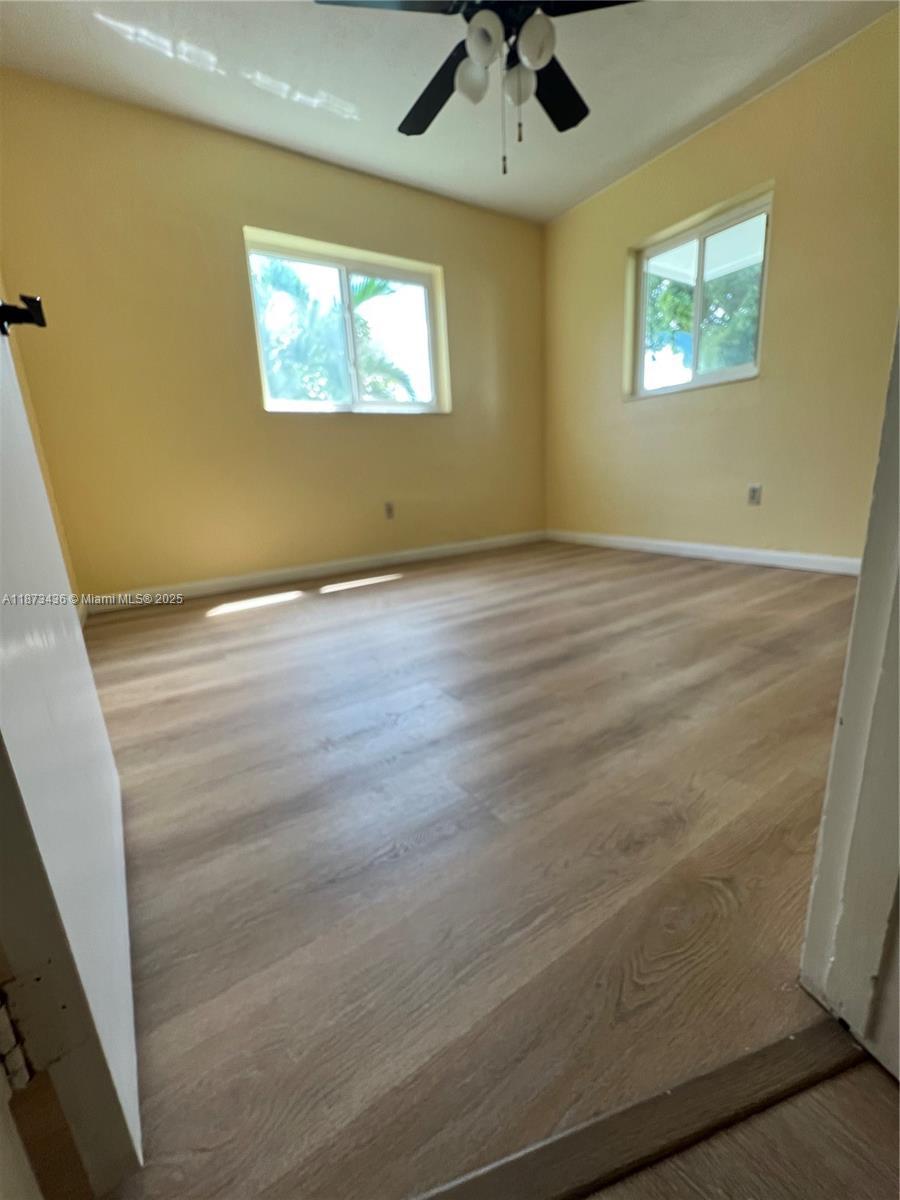 10315 Southwest 152nd Terrace Miami, FL 33157 - Photo 5 of 12 a view of room with window and ceiling fan