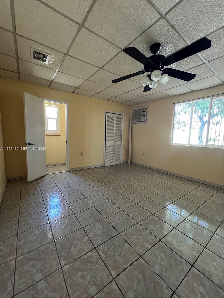 10315 Southwest 152nd Terrace Miami, FL 33157 - Photo 8 of 12 a view of empty room with windows