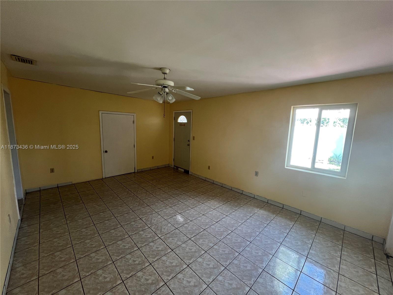 10315 Southwest 152nd Terrace Miami, FL 33157 - Photo 9 of 12 a view of an empty room with a window