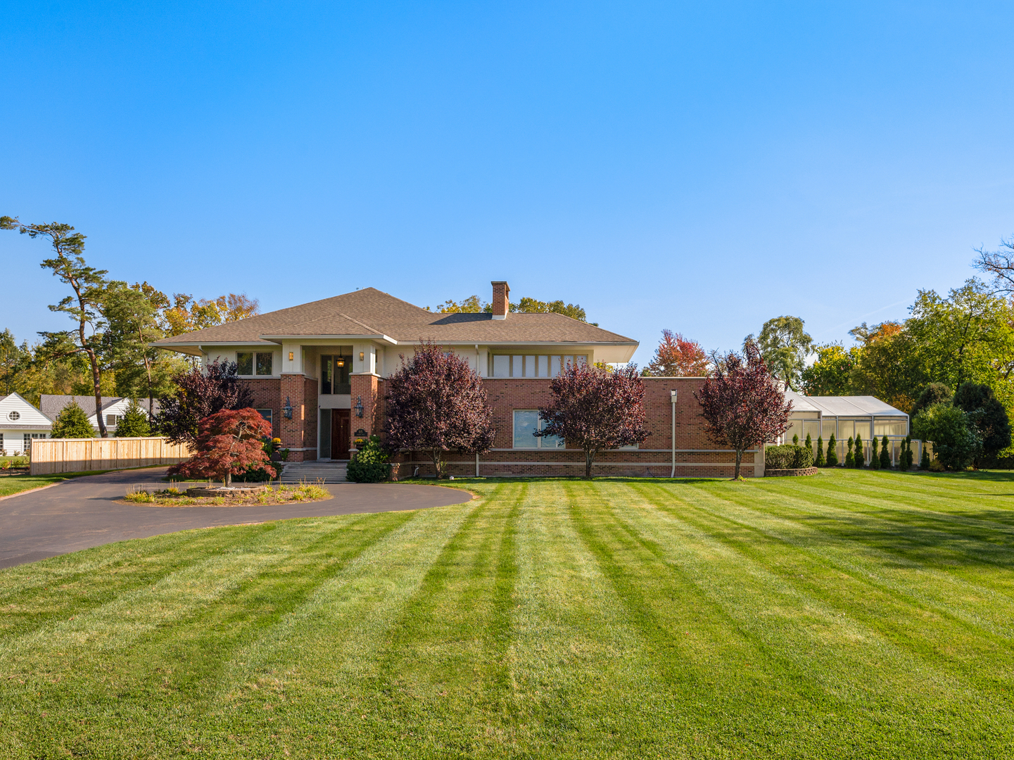 115 Dickens Road Northfield, IL 60093 - Photo 1 of 24 a view of a house with swimming pool and yard