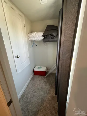 a bedroom with a bed and furniture