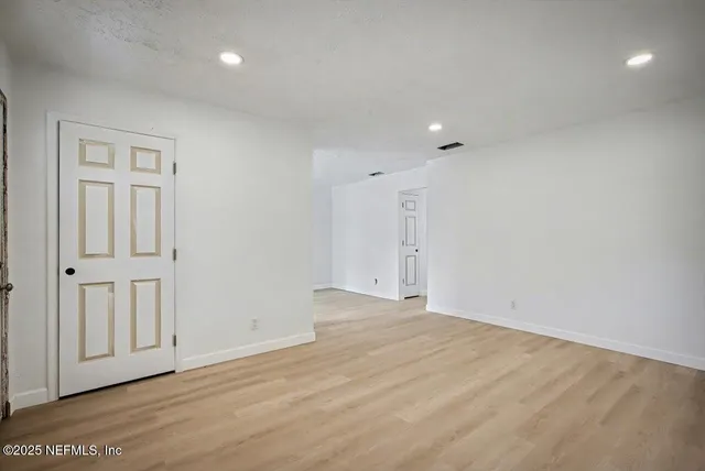 a view of a dining room with furniture and window