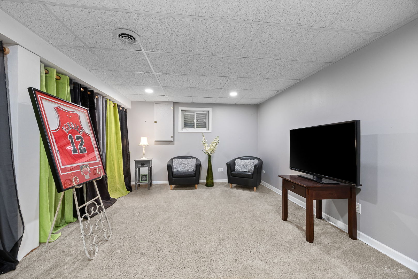 1910 Baldwin Way Bolingbrook, IL 60490 - Photo 28 of 38 a living room with furniture and a flat screen tv