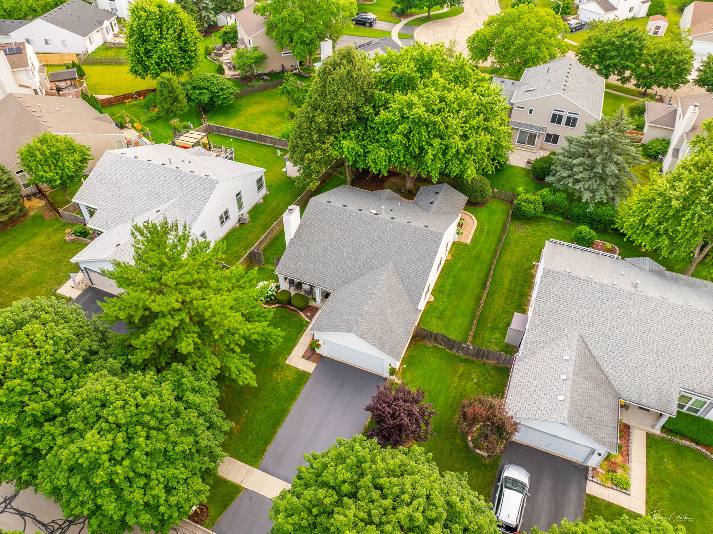1910 Baldwin Way Bolingbrook, IL 60490 - Photo 34 of 38 an aerial view of a house with a garden and lots of trees