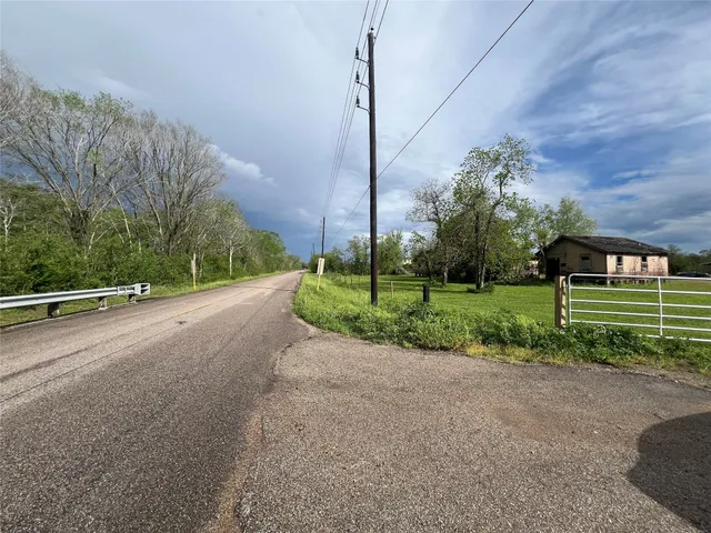 a view of a house with a street