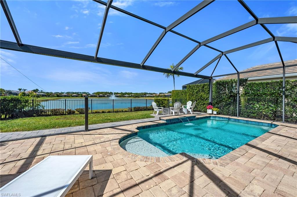 3634 Canopy Circle Naples, FL 34120 - Photo 16 of 20 Swimming Pool with Picture Window Screen, Fire Pit, and Long Lake View