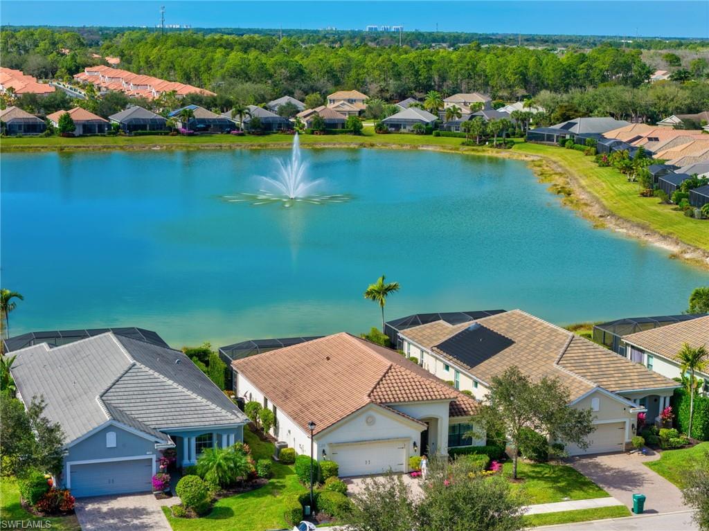 3634 Canopy Circle Naples, FL 34120 - Photo 19 of 20 Aerial View of House Featuring Lake with Fountain