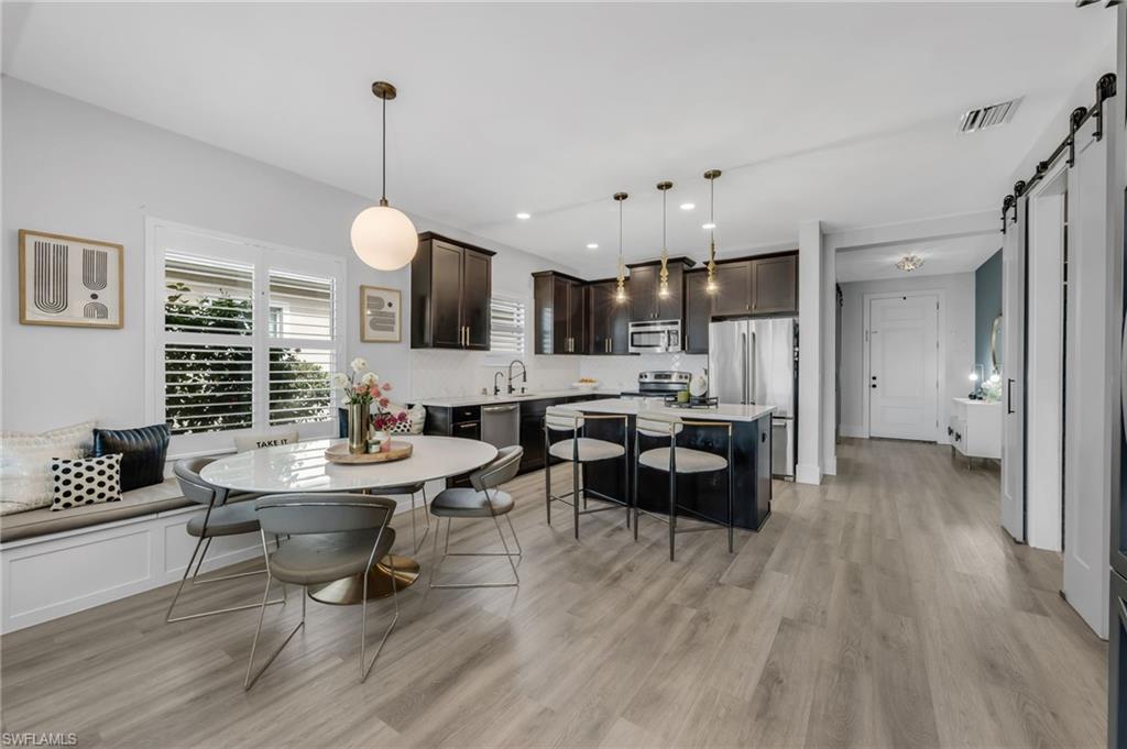 3634 Canopy Circle Naples, FL 34120 - Photo 4 of 20 Dining Area and Kitchen