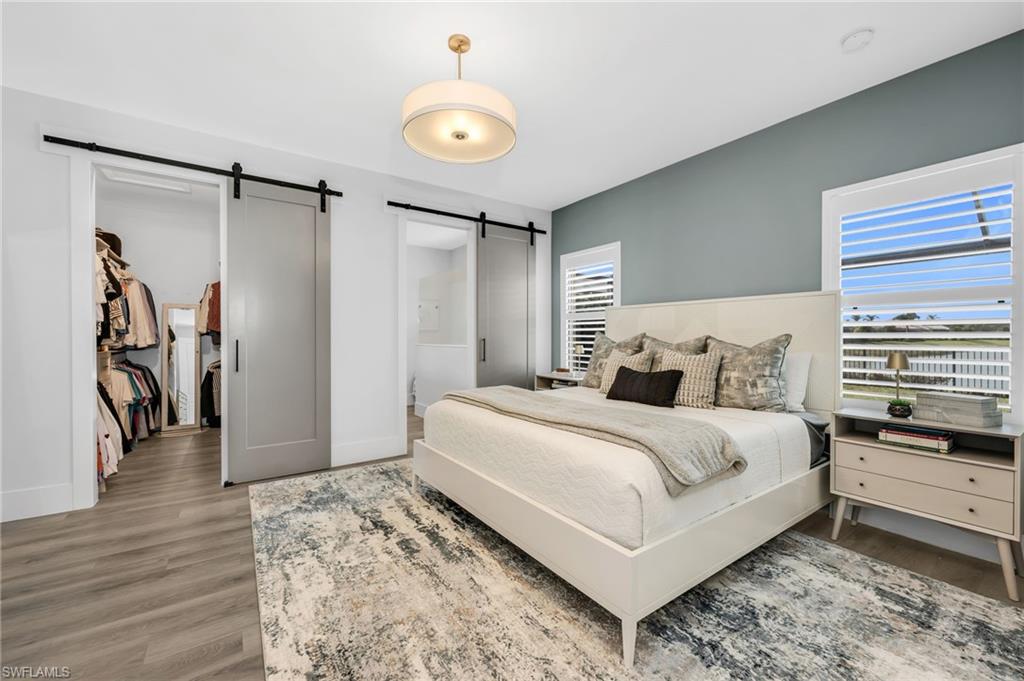 3634 Canopy Circle Naples, FL 34120 - Photo 8 of 20 Primary Bedroom with Walk-In Closet and Barn Doors