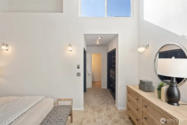 a spacious bathroom with a granite countertop sink and a mirror