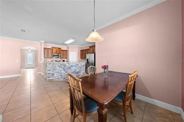a dining room with furniture and window