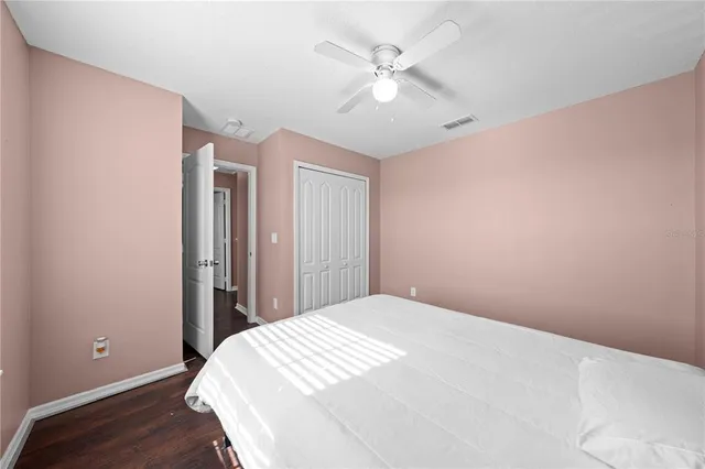 a view of a hallway with entryway and kitchen view