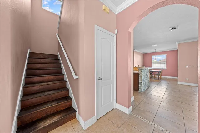 a bedroom with a bed and a tv