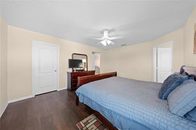 a bedroom with a bed and a dresser