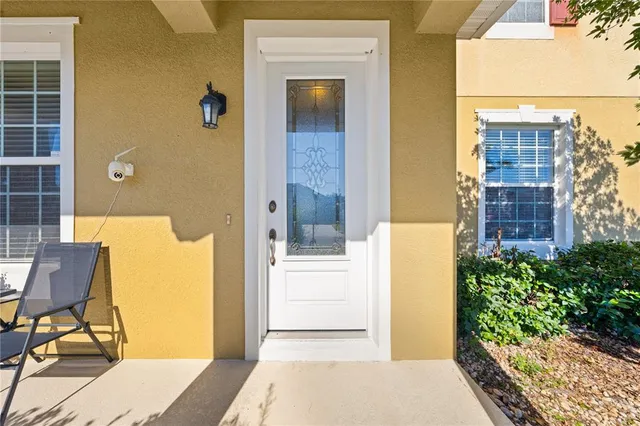 a balcony with a table and chairs