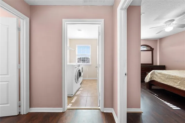 a bathroom with a granite countertop double vanity sink and mirror