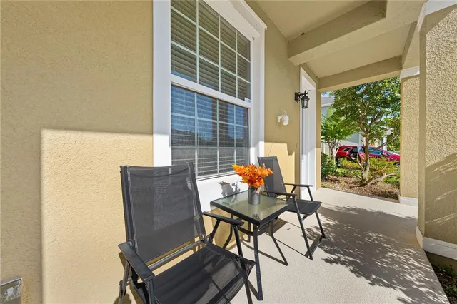 a outdoor living space with furniture and a potted plant