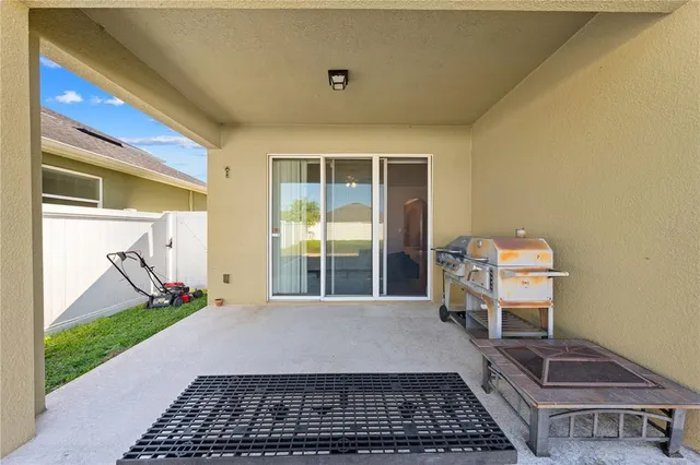 a sign broad in front of the red white house