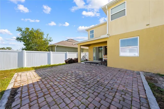 a view of a swimming pool with a patio