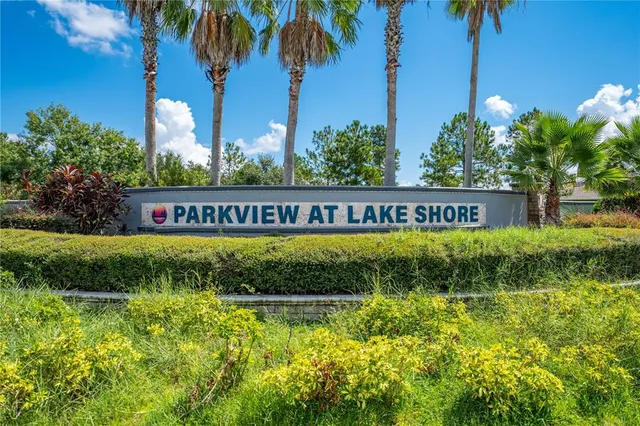 a view of a golf course with a lake
