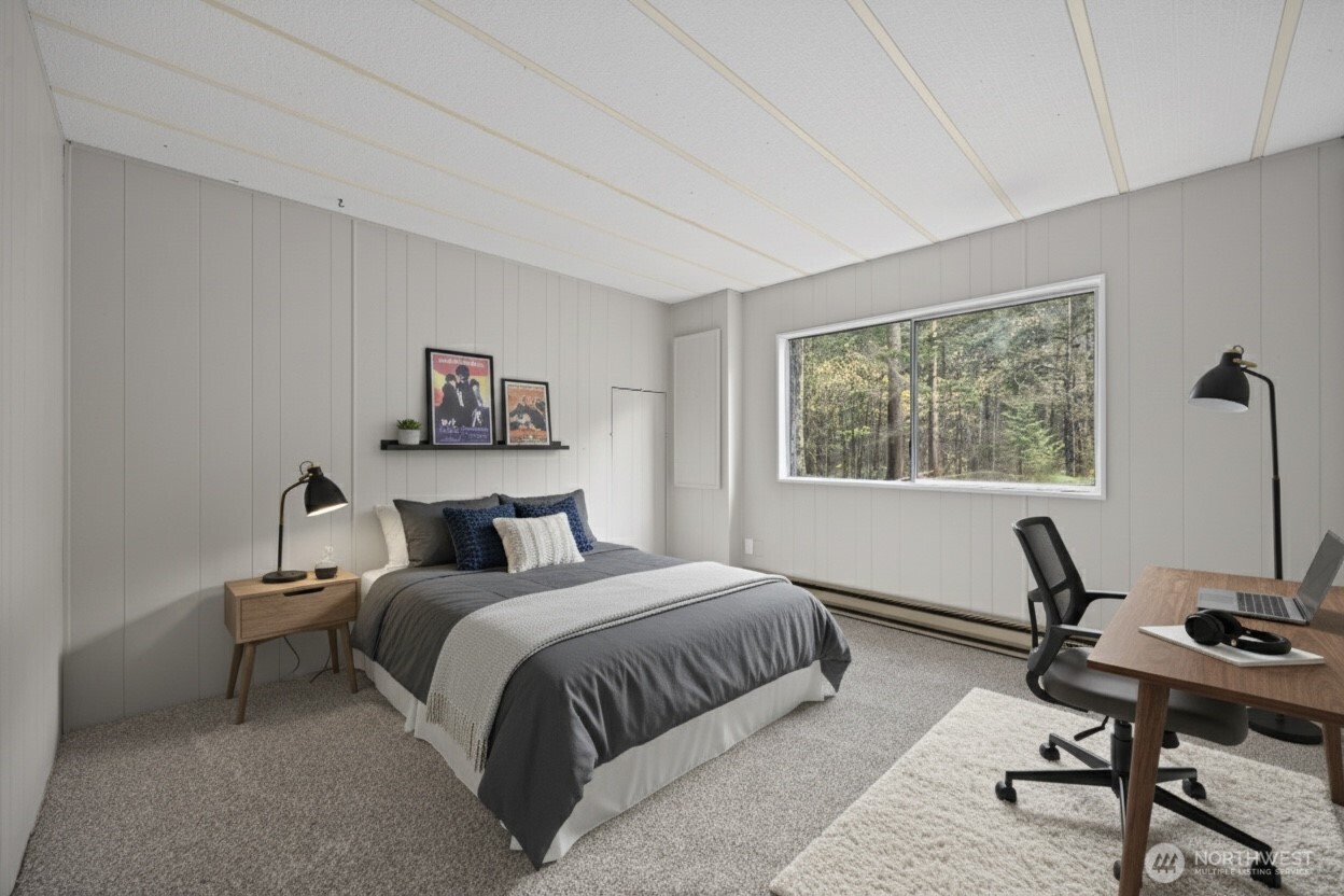 8532 Juniper Place Maple Falls, WA 98266 - Photo 16 of 37 a bedroom with a bed a desk and chair