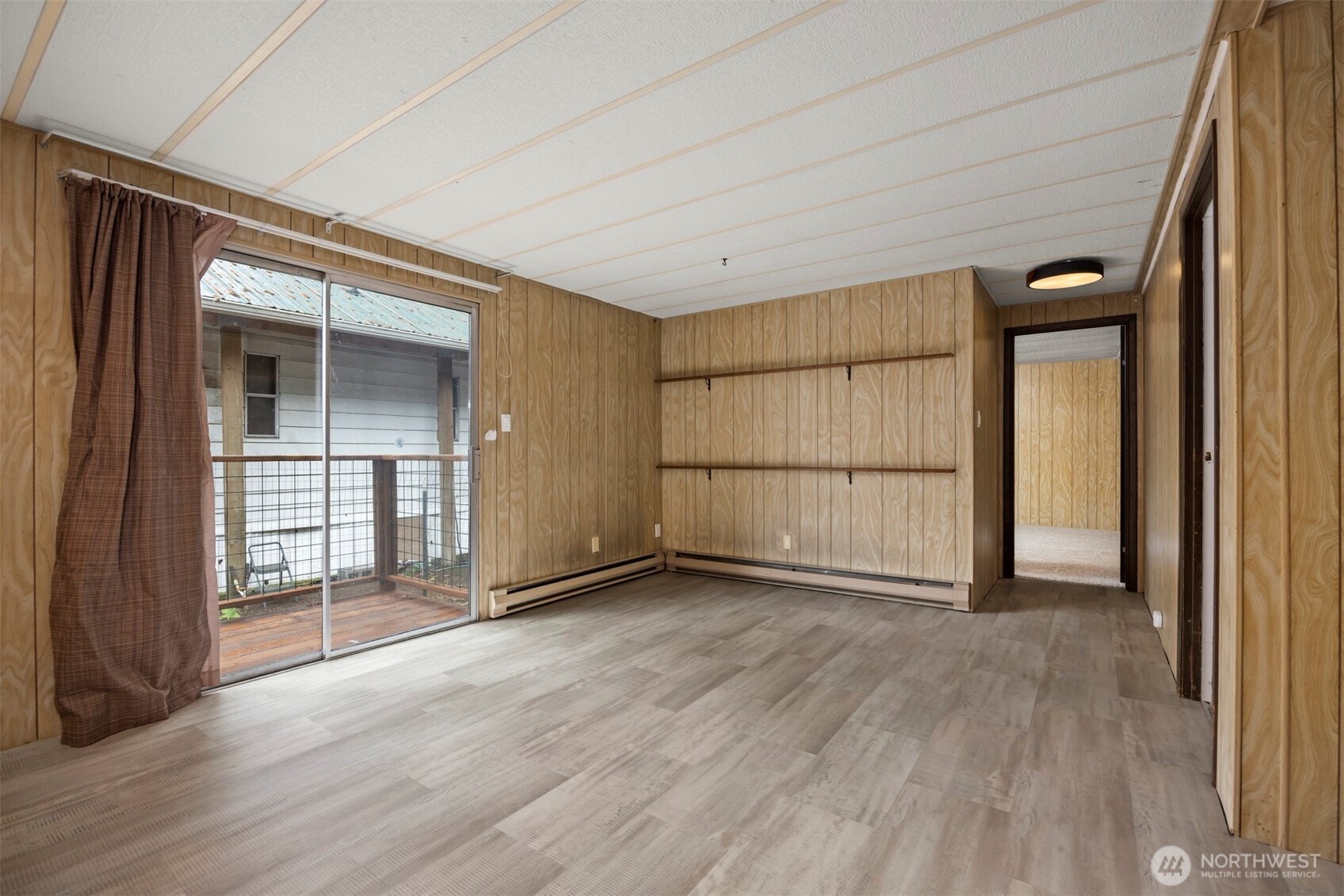 8532 Juniper Place Maple Falls, WA 98266 - Photo 18 of 37 an empty room with wooden floor and a window