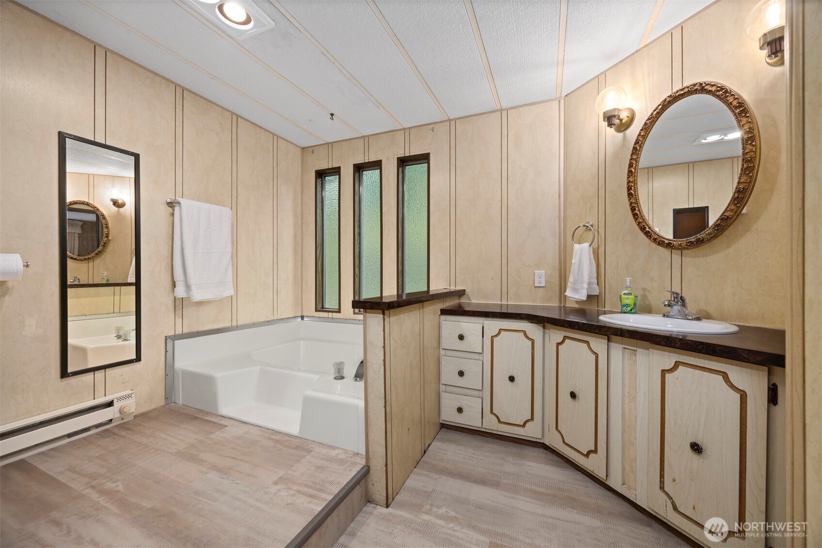 8532 Juniper Place Maple Falls, WA 98266 - Photo 25 of 37 a hall with a sink and a large mirror