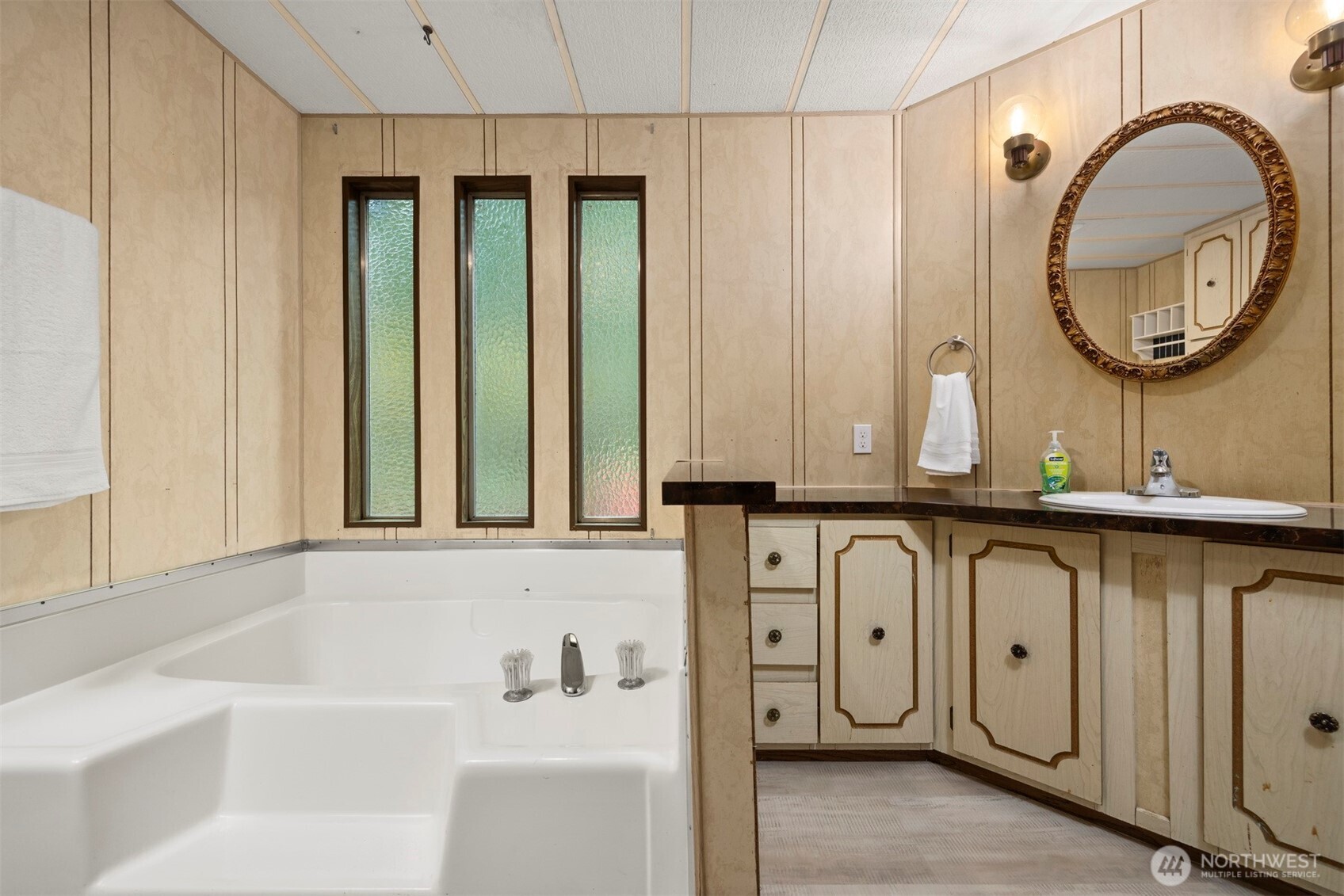 8532 Juniper Place Maple Falls, WA 98266 - Photo 26 of 37 a bathroom with a granite countertop tub sink and mirror