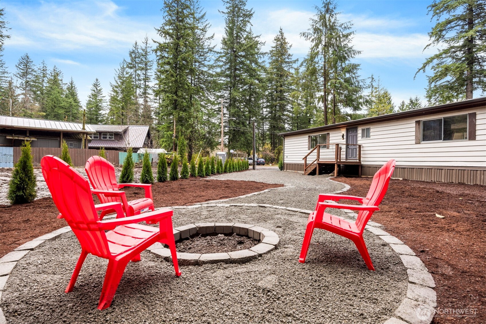 8532 Juniper Place Maple Falls, WA 98266 - Photo 33 of 37 a backyard of a house with table and chairs