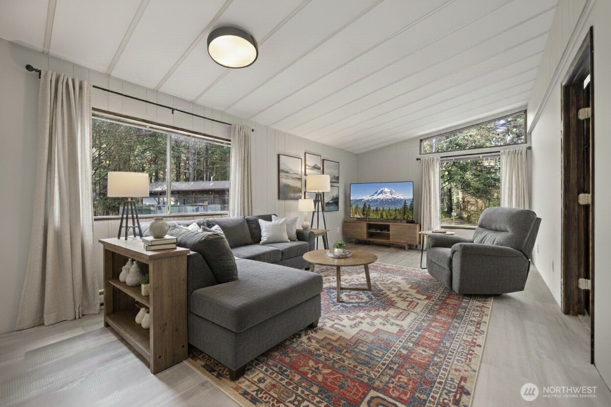 8532 Juniper Place Maple Falls, WA 98266 - Photo 7 of 37 a living room with fireplace furniture and a large window