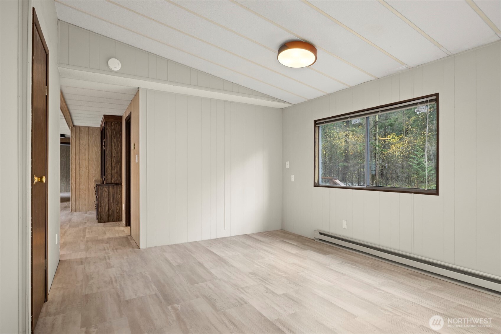 8532 Juniper Place Maple Falls, WA 98266 - Photo 9 of 37 a view of empty room with window and wooden floor