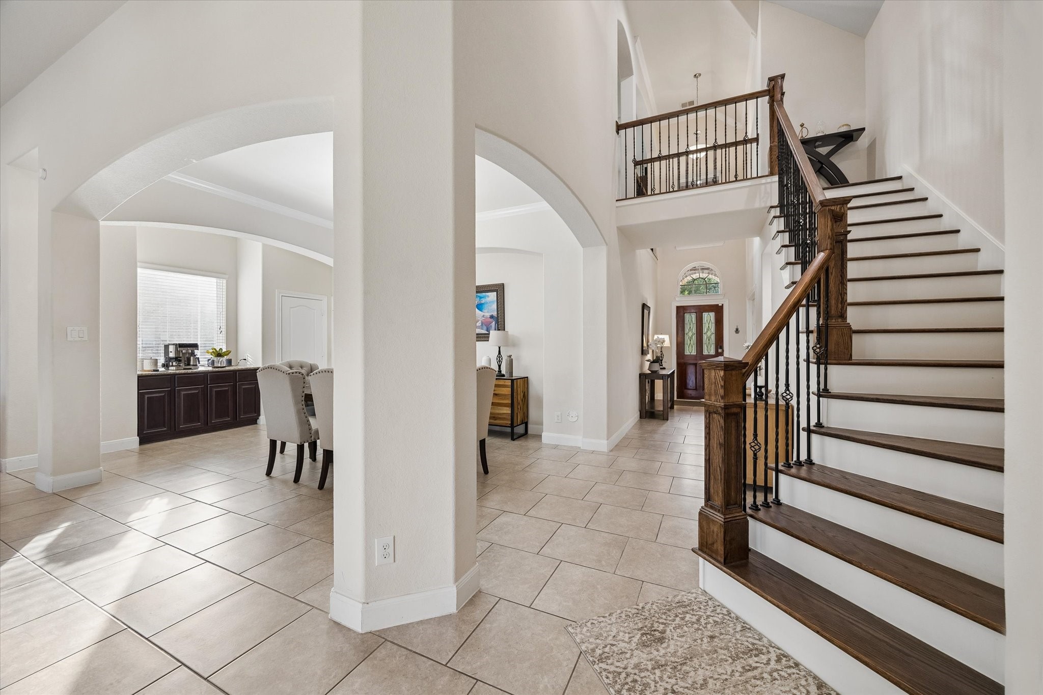 3306 Explorer Way Conroe, TX 77301 - Photo 7 of 35 View of entrance, dinning area and gorgeous staircase leading to family room and half bath.