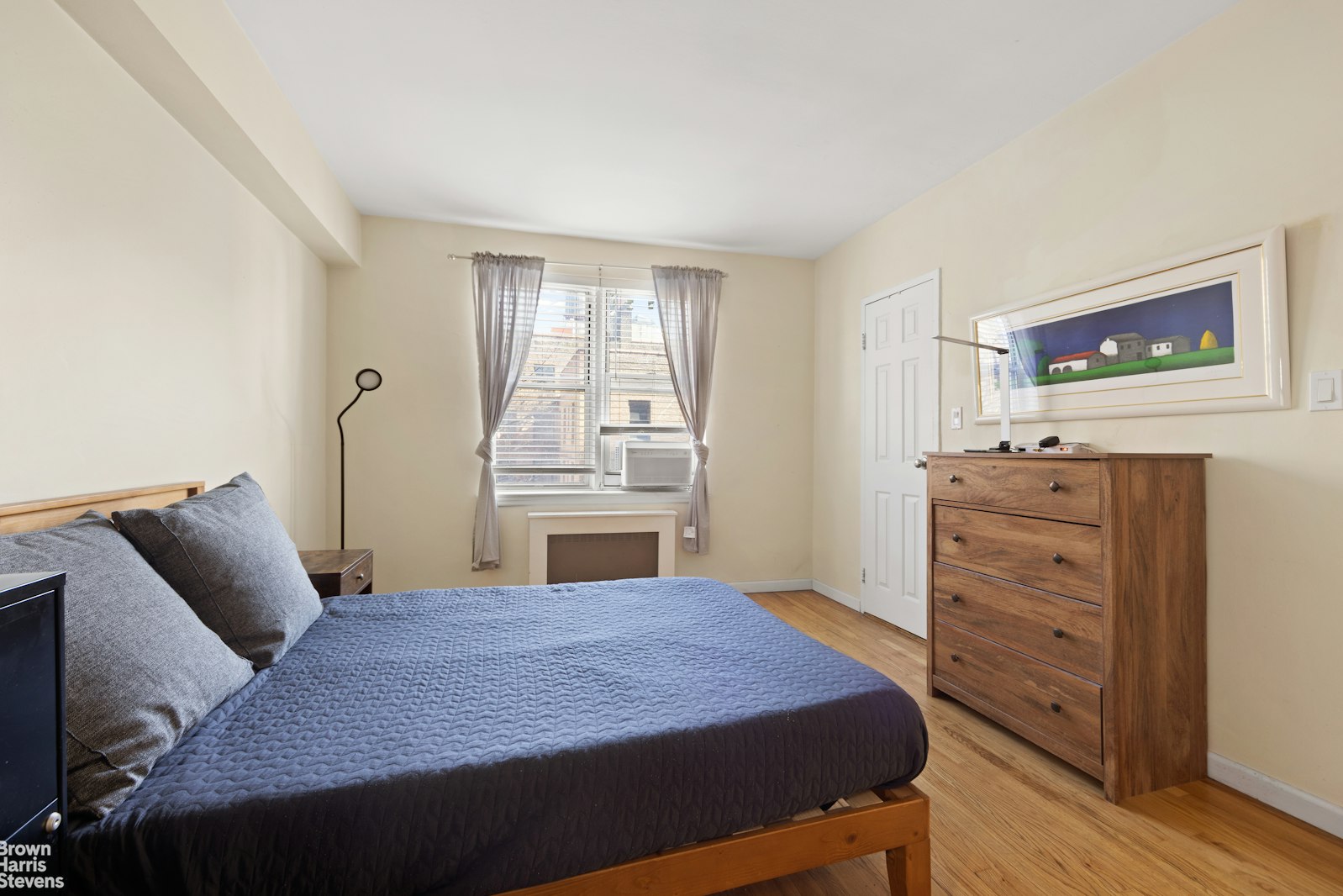 800 Grand Concourse, Unit 3LN Bronx, NY 10451 - Photo 6 of 9 a bedroom with a bed and a cabinets