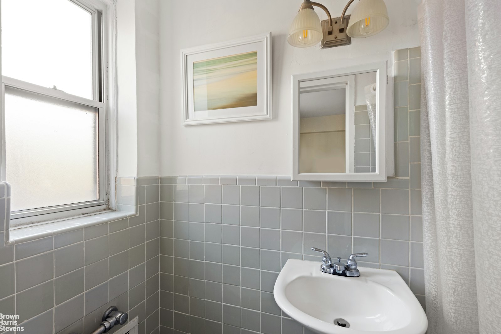 800 Grand Concourse, Unit 3LN Bronx, NY 10451 - Photo 8 of 9 a bathroom with a sink a window and shower