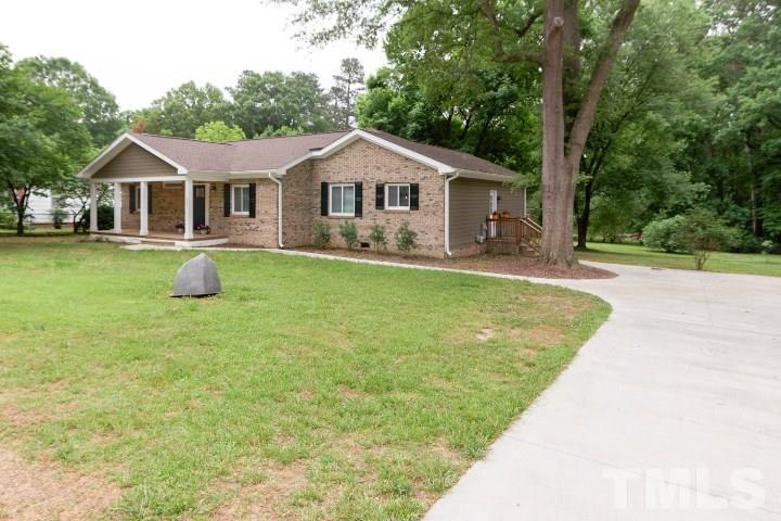 521 Ranch Farm Road Raleigh, NC 27603 - Photo 2 of 30 a front view of a house with garden
